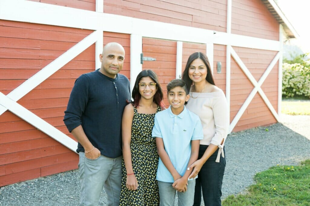From left to right: Parm, his two children, and his wife Gurpreet.